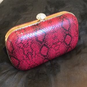 Used Snake print clutch in maroon/black.Chic💕💕